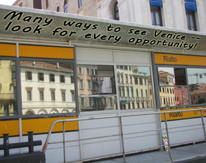 Venice as seen from the Rialto boat stop;
                          reflections